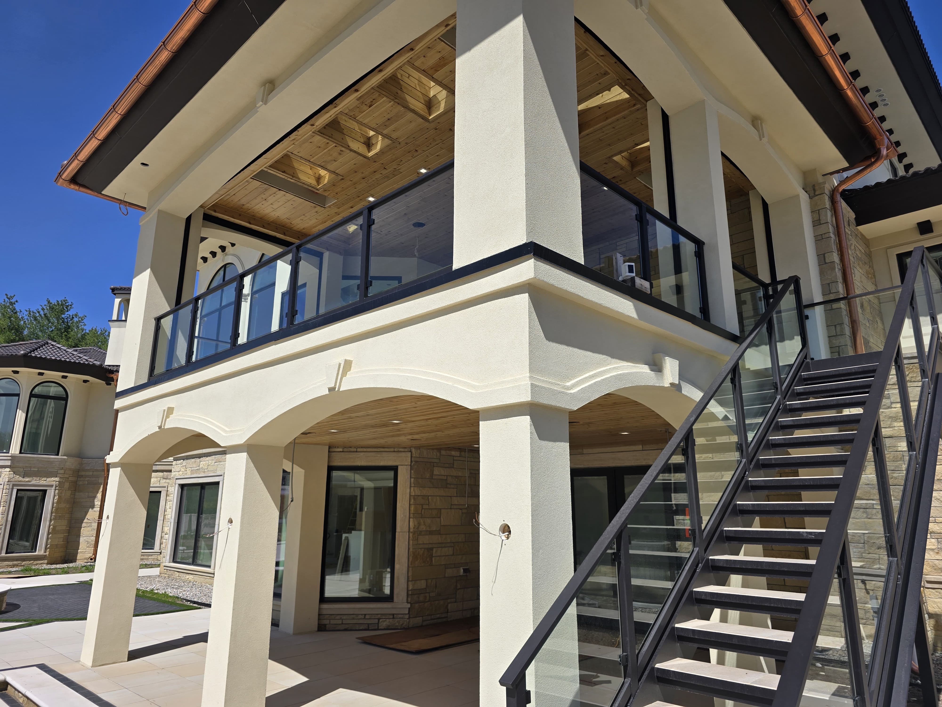 Customized Deck Railings in Warren, MI | San Marino - Northville%20Glass%20Rail%20with%20Top_Bottom%20Steel%20Cap%20(2)